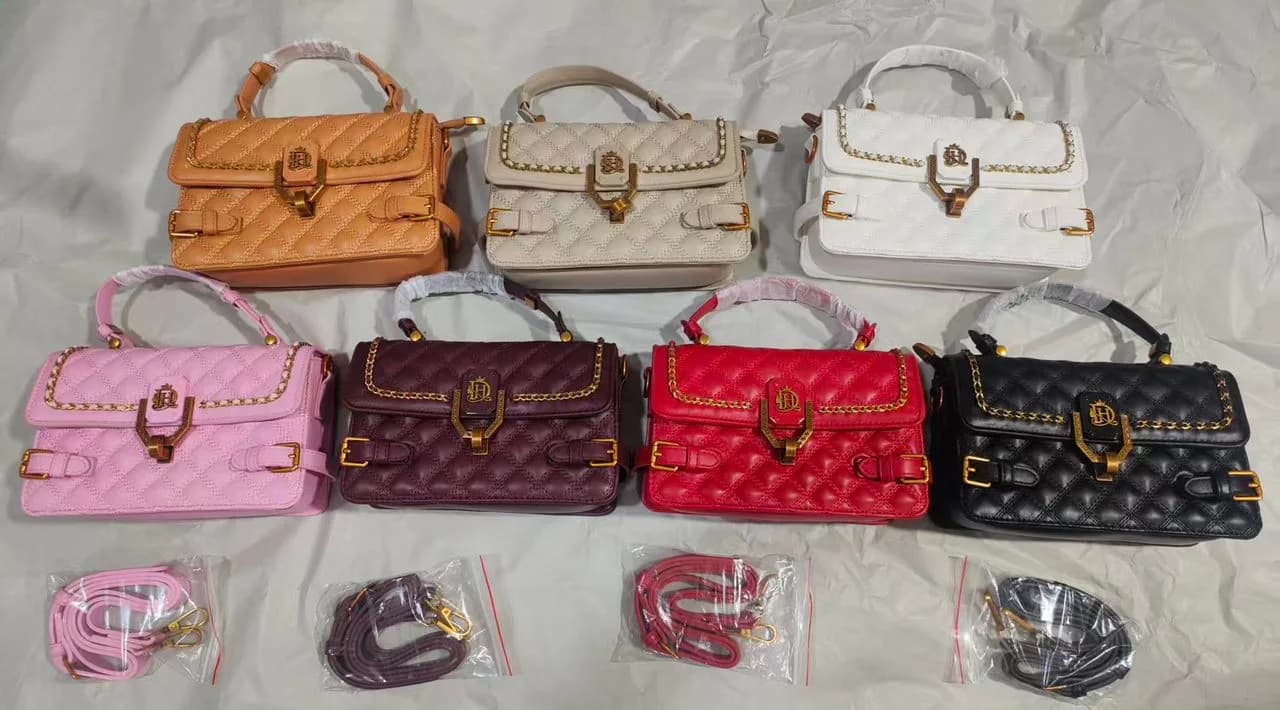 The Buckle Bag in all seven colours: Black, White, Beige, Tan, Pink, Red and Burgundy