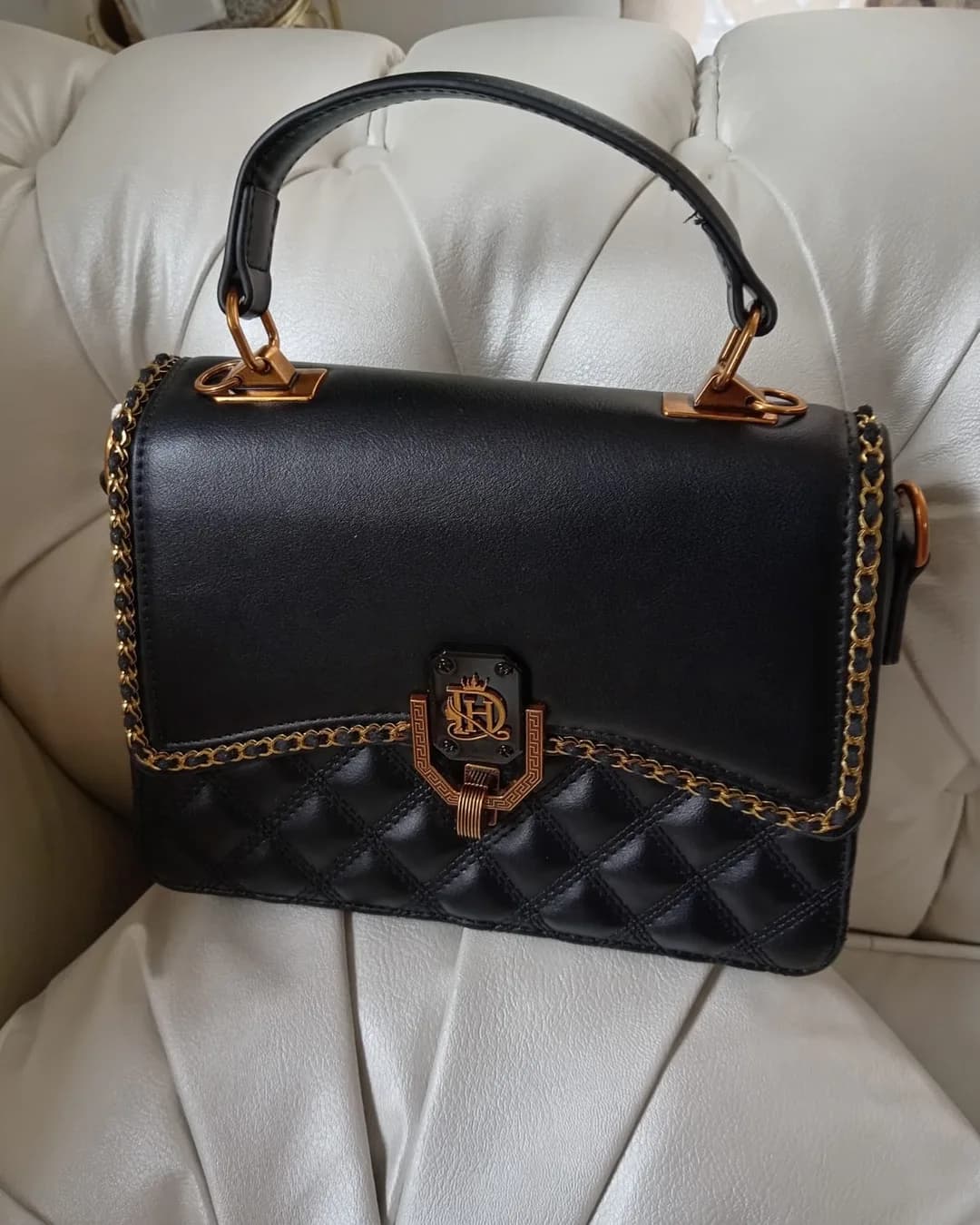The Chain-Trim Bag in Black, front view